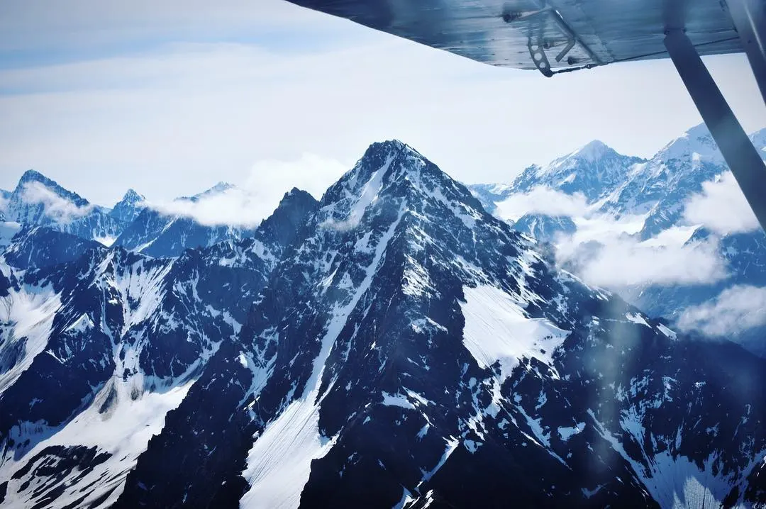 flying over alaskan mountains in a flight school class