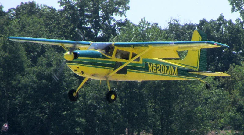 cessna 180 bush plane taking off in alaska